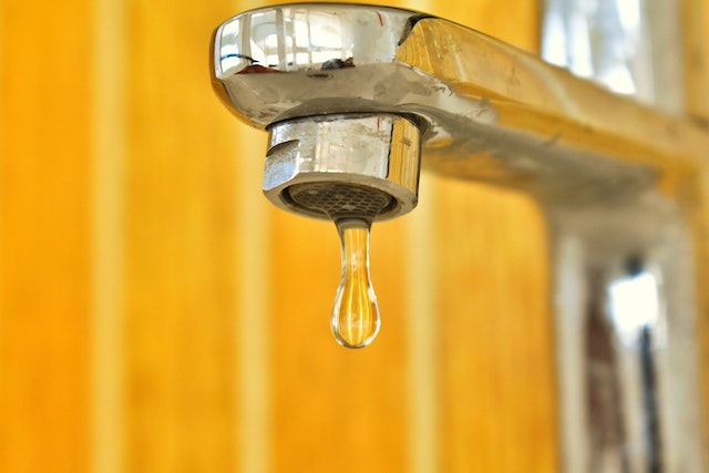 diy tips all homeowners should know - fixing a leaking tap - chrome tap dripping water