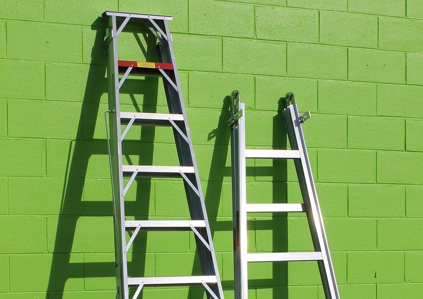 Ladders leaning against a wall